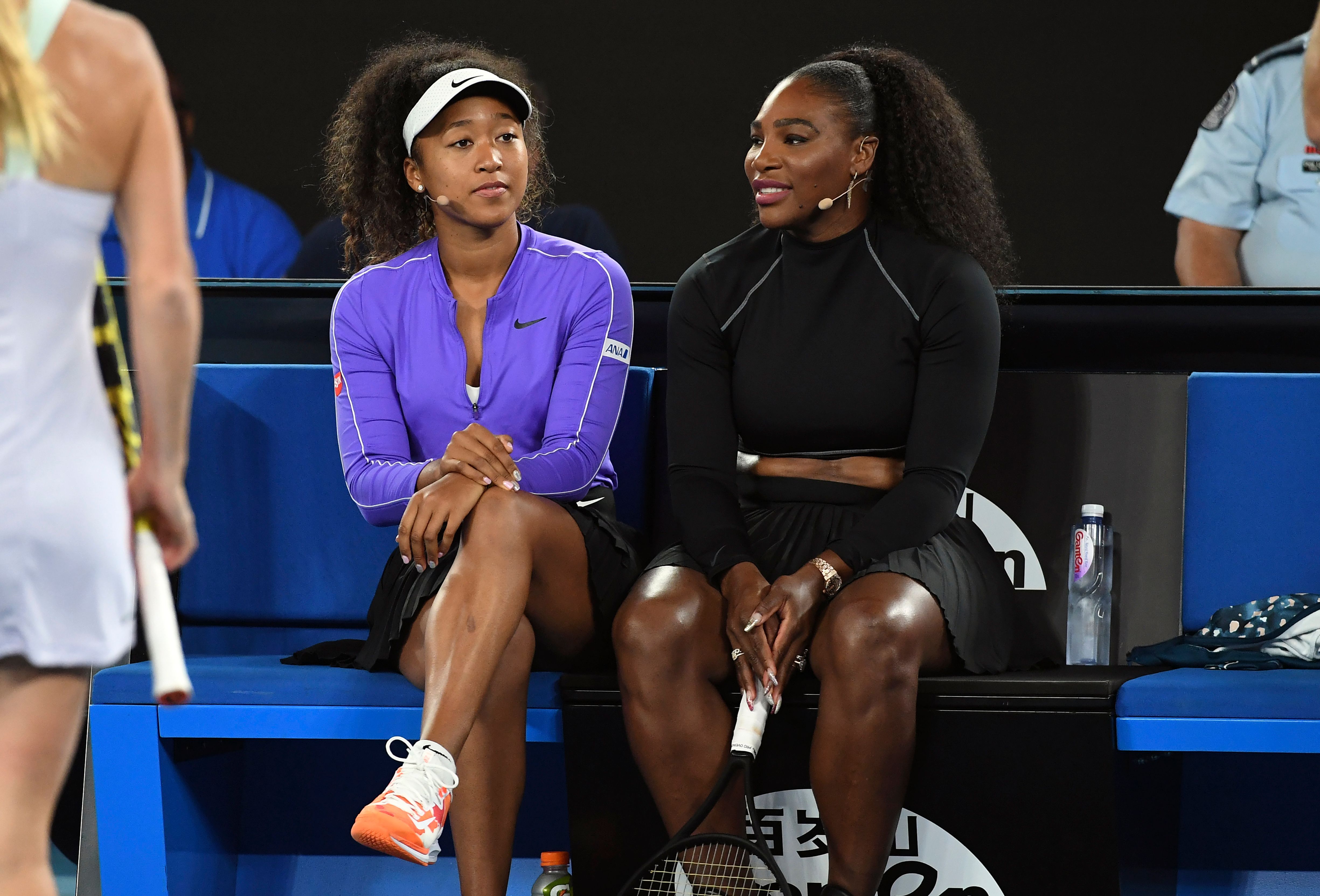 Tennis player Naomi Osaka claps back at two fans after they criticize her f...