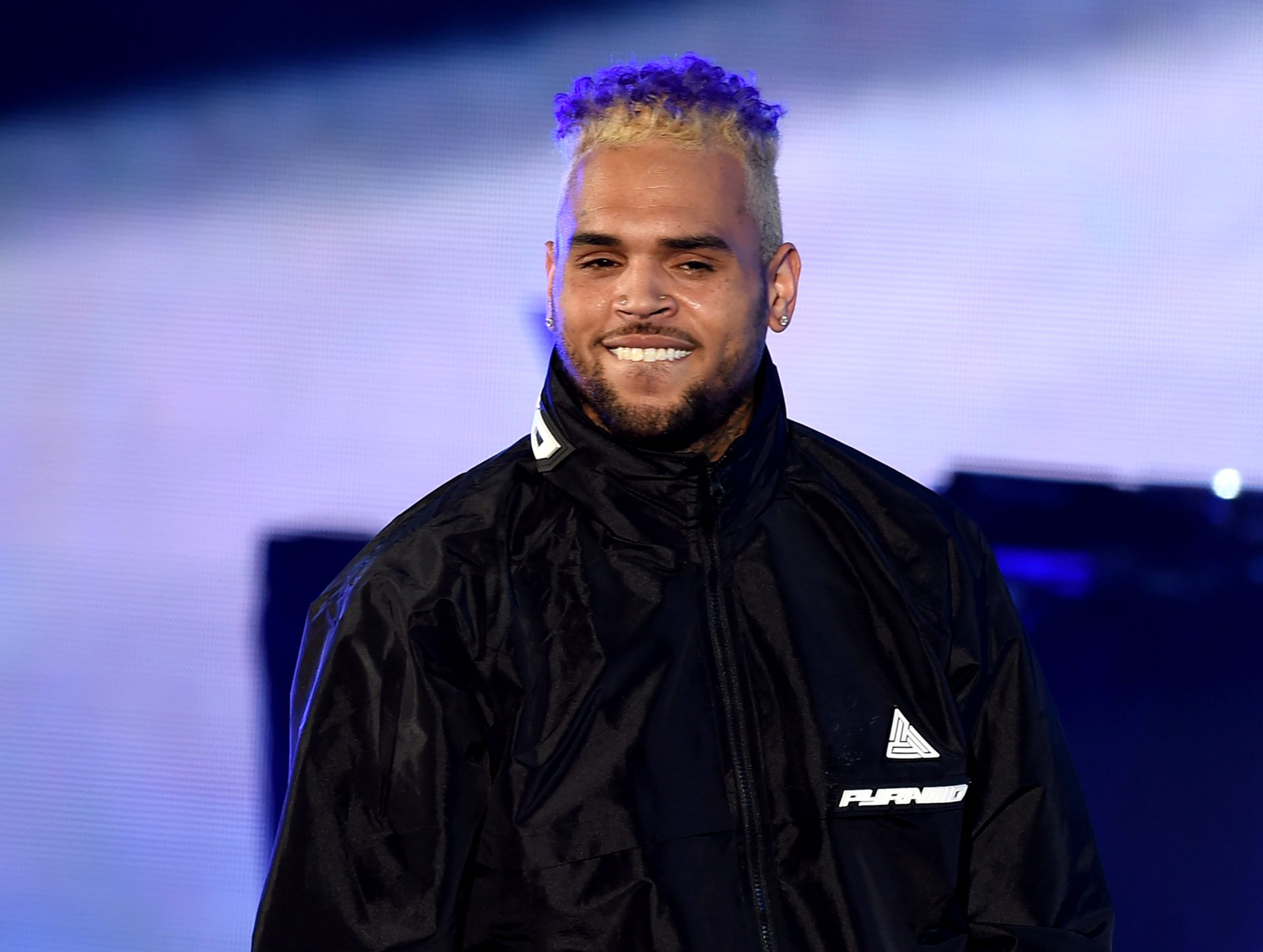 Chris Brown shares the official release date and list of artists for his upcoming album "Breezy," dropping next month.