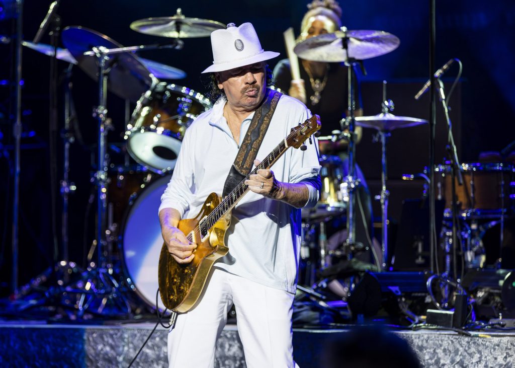 Carlos Santana was hospitalized after collapsing on stage from heat exhaustion and dehydration while performing in Michigan.