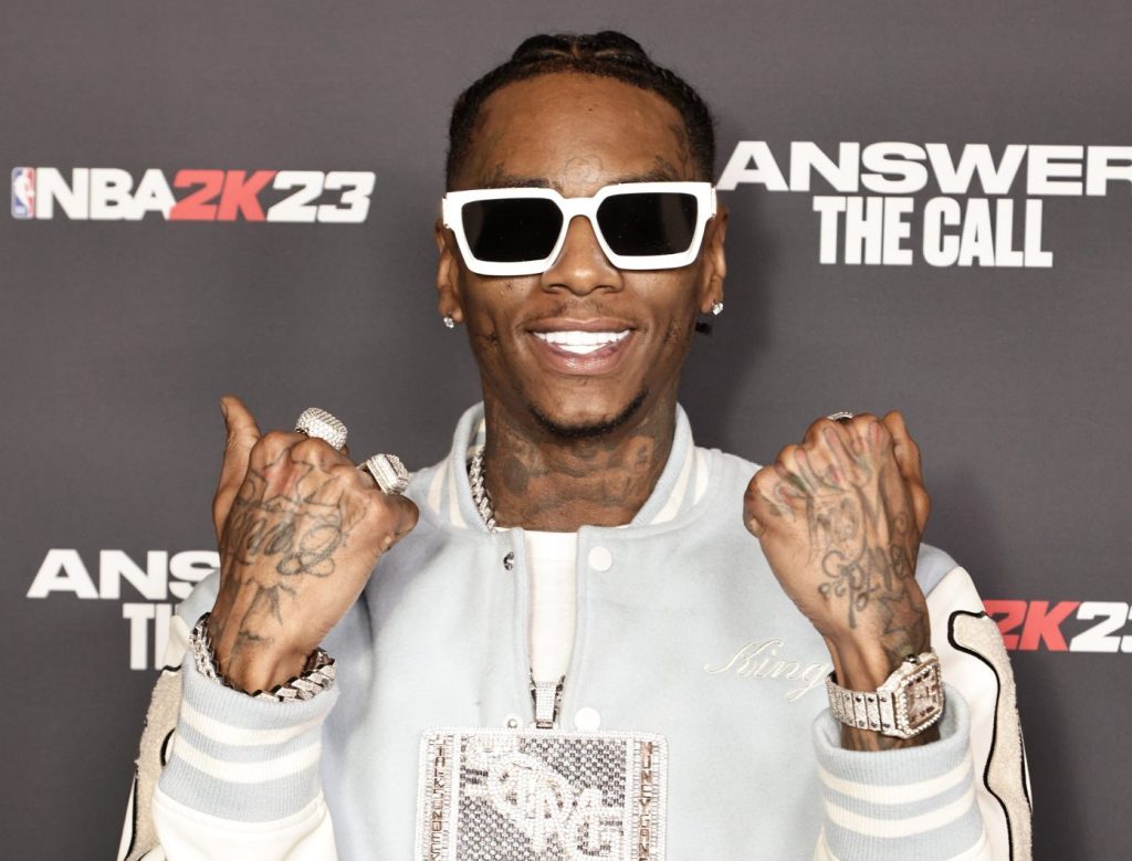 Soulja Boy took to social media to share a photo of him holding his son, officially announcing his son's birth.
