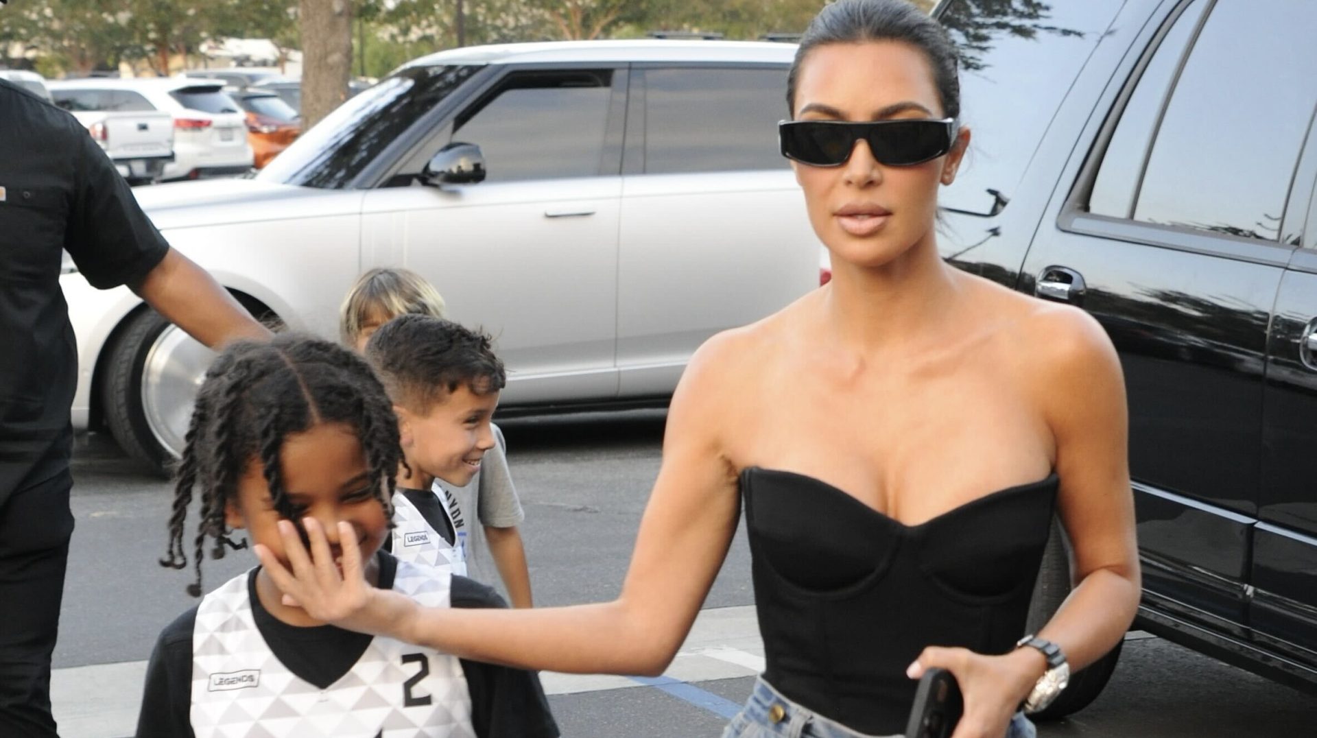 Saint West Flips Off Paparazzi With Kim Kardashian
