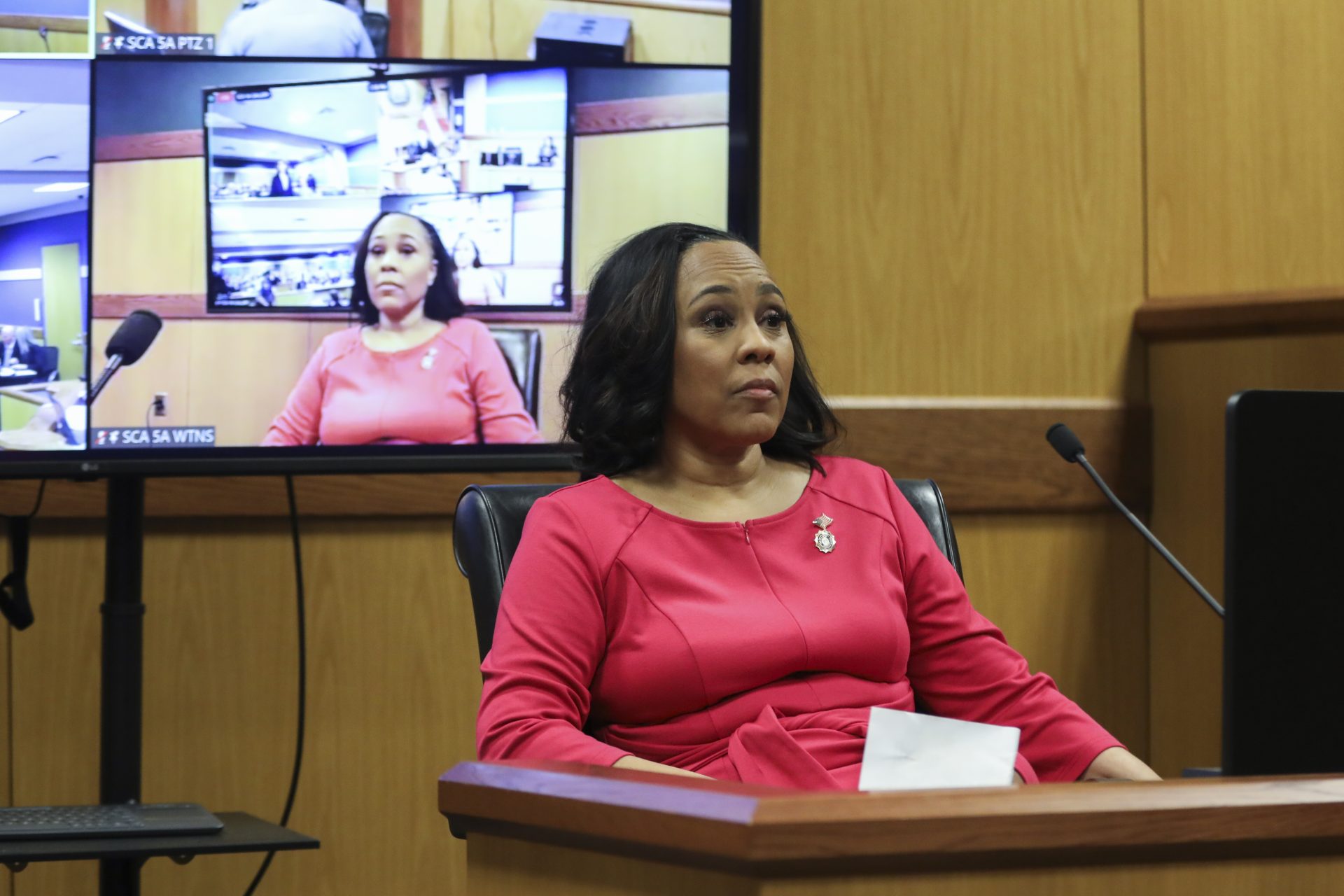 ATLANTA, GA - FEBRUARY 15: Fulton County District Attorney Fani Willis takes the stand as a witness during a hearing in the case of the State of Georgia v. Donald John Trump at the Fulton County Courthouse on February 15, 2024 in Atlanta, Georgia. Judge Scott McAfee is hearing testimony as to whether Willis and Special Prosecutor Nathan Wade should be disqualified from the case for allegedly lying about a personal relationship.