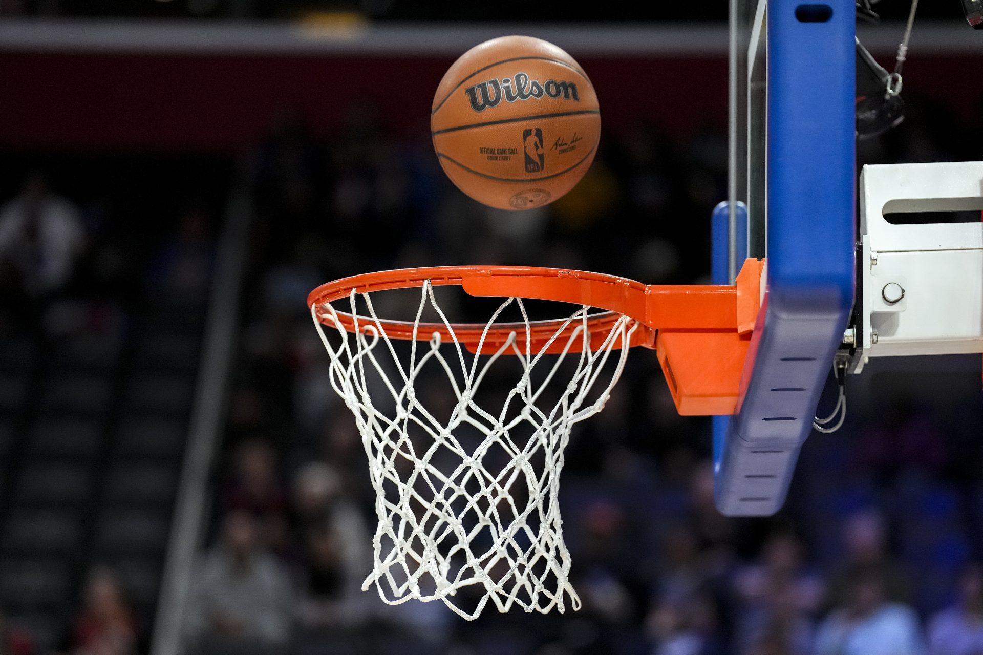 DETROIT, MICHIGAN - NOVEMBER 20: A Wilson Brand NBA official game ball is pictured falling through a basketball hoop and net before the game between the Detroit Pistons and Denver Nuggets at Little Caesars Arena on November 20, 2023 in Detroit, Michigan. NOTE TO USER: User expressly acknowledges and agrees that, by downloading and or using this photograph, User is consenting to the terms and conditions of the Getty Images License Agreement.