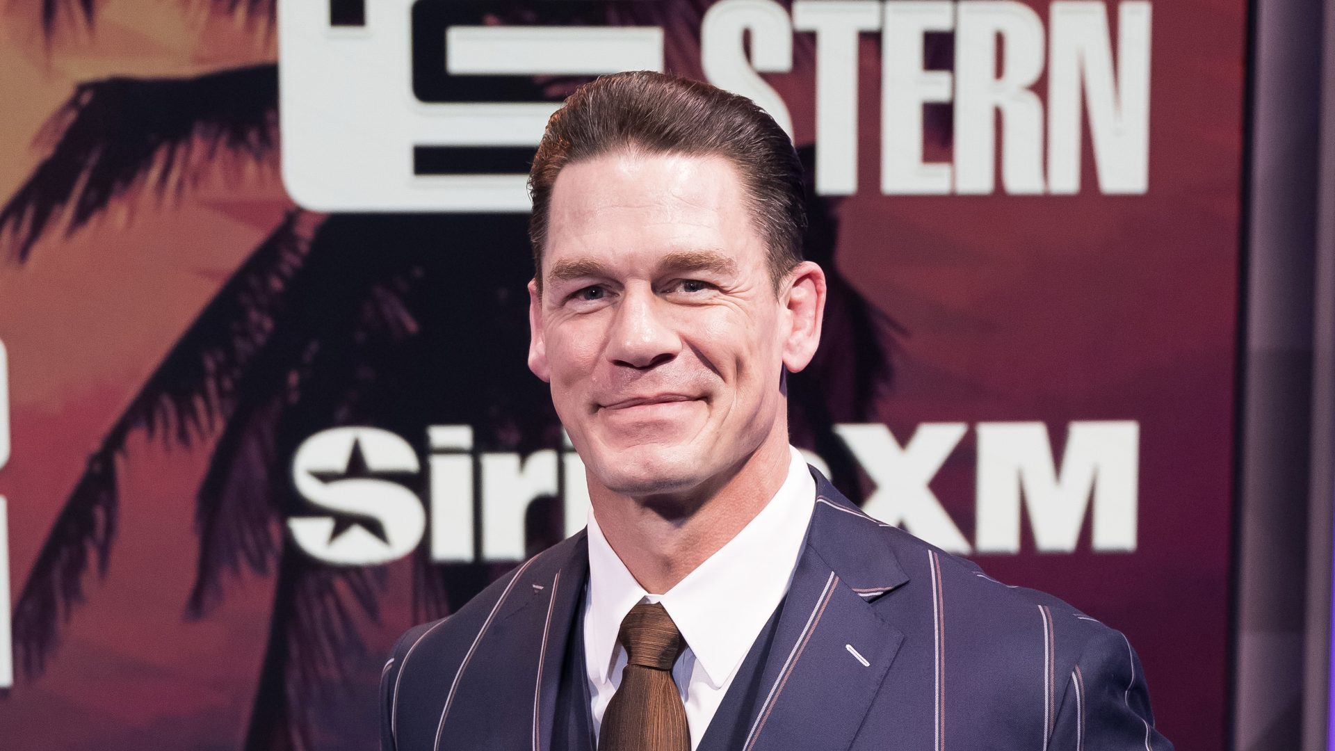 MIAMI BEACH, FLORIDA - FEBRUARY 21: John Cena visits 'The Howard Stern Show' at SiriusXM Studios on February 21, 2024 in Miami Beach, Florida.