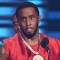 Diddy hospital prison fight Jamaican drug lord Christopher Dudus Coke family denies
